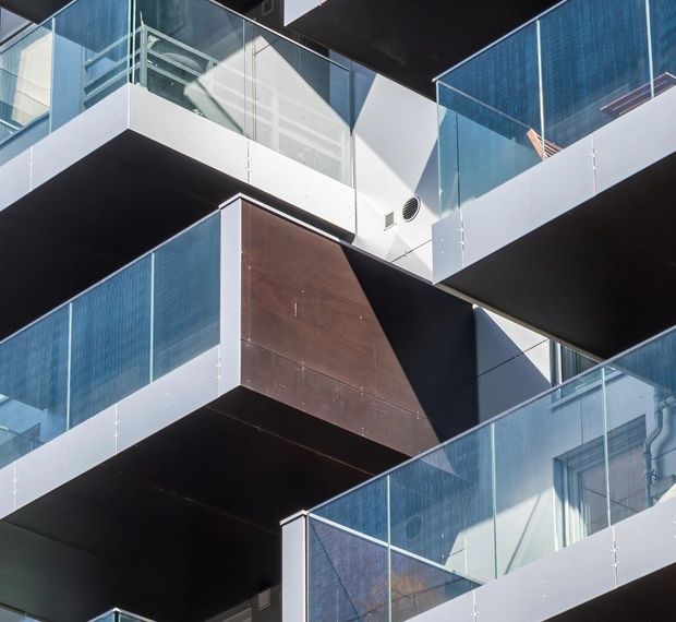 Modern multifamily property with glass balconies